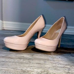 Only worn a few times. Tan color high heels 6 inch heels.